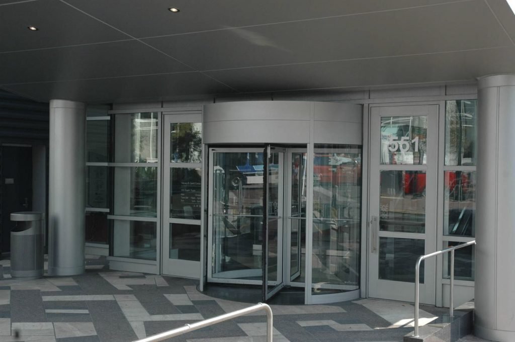 Dark-framed glass storefront with business signage