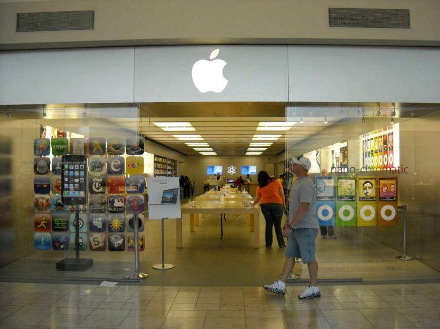 Glass storefront doors with angled metal awning