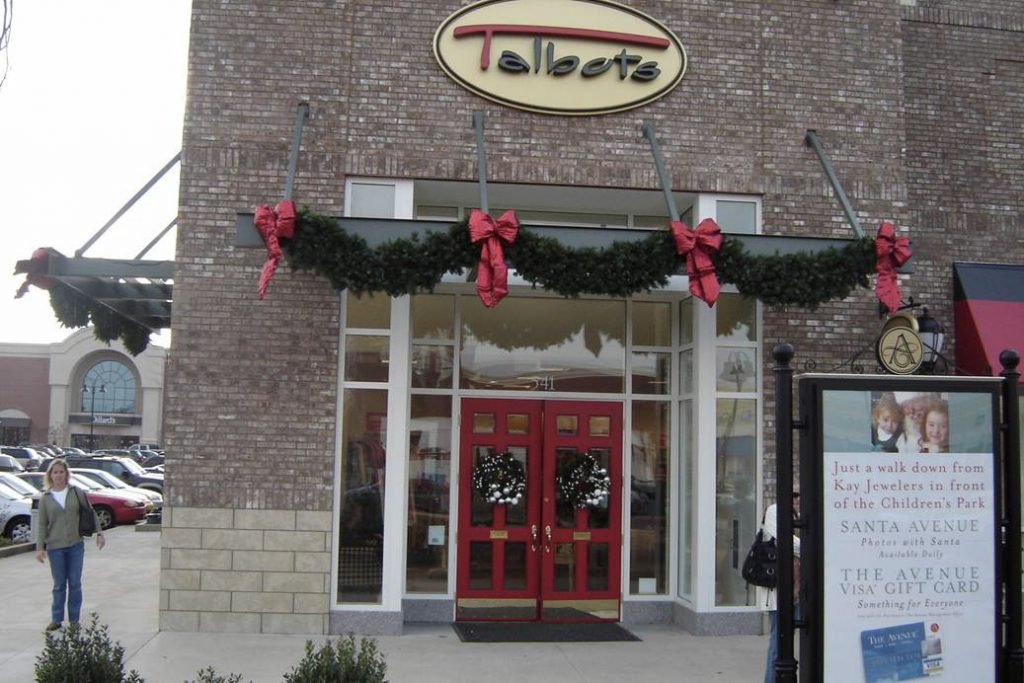 Narrow glass storefront doors on compact urban store
