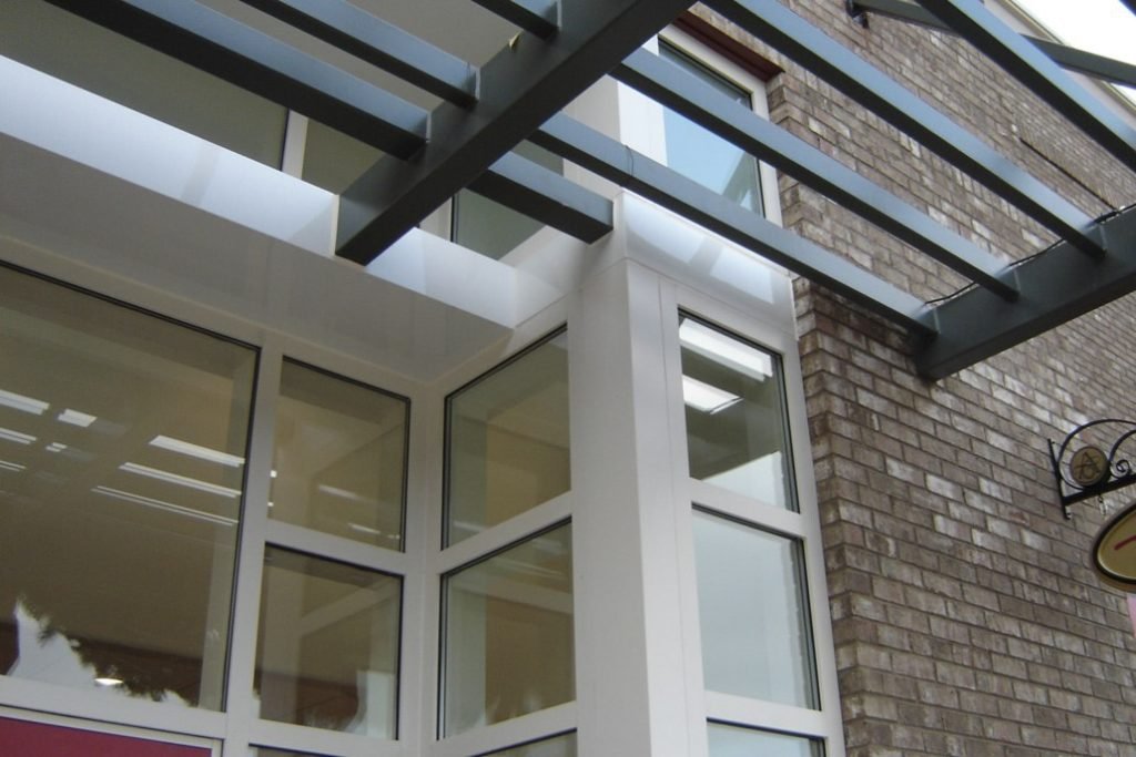 Glass storefront doors in modern office entryway