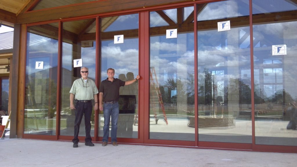 Full-height glass storefront doors with wide display panels