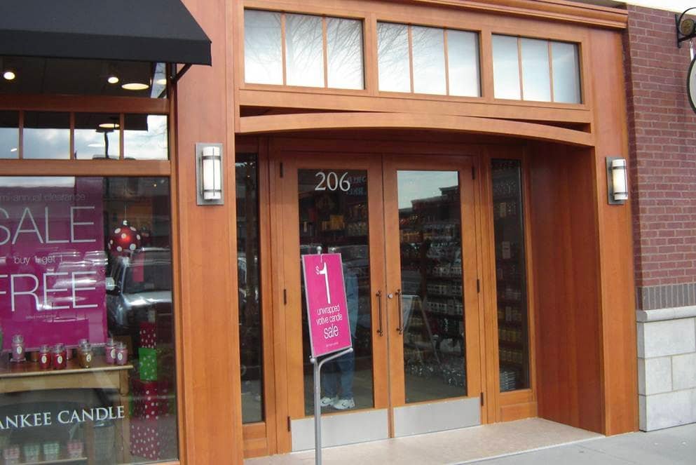 Glass storefront doors with transom windows above